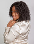 Black woman wearing Coils to Locs Imani wig black