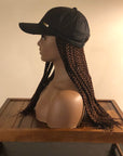 Mannequin wearing a Coils to Locs Kimmie Cap with brown 18" braids, side view.