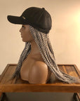 Mannequin wearing a Coils to Locs Kimmie Cap with gray 18" braids, side view.