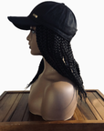 Coils to Locs Kimmie Cap, braided hats with hair, in black, side view.