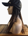 Coils to Locs Kimmie Cap 12" braids in black copper ombre, side view on manneqin.