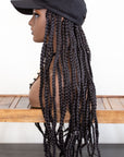 Mannequin wearing Coils to Locs kimmie cap black hair braids side view.