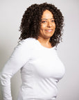 Coils to Locs Cleo wig, soft perm rod curls in dark brown showing a partial front/side view.