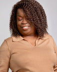 Black woman wearing Coils to Locs Imani synthetic wig brown