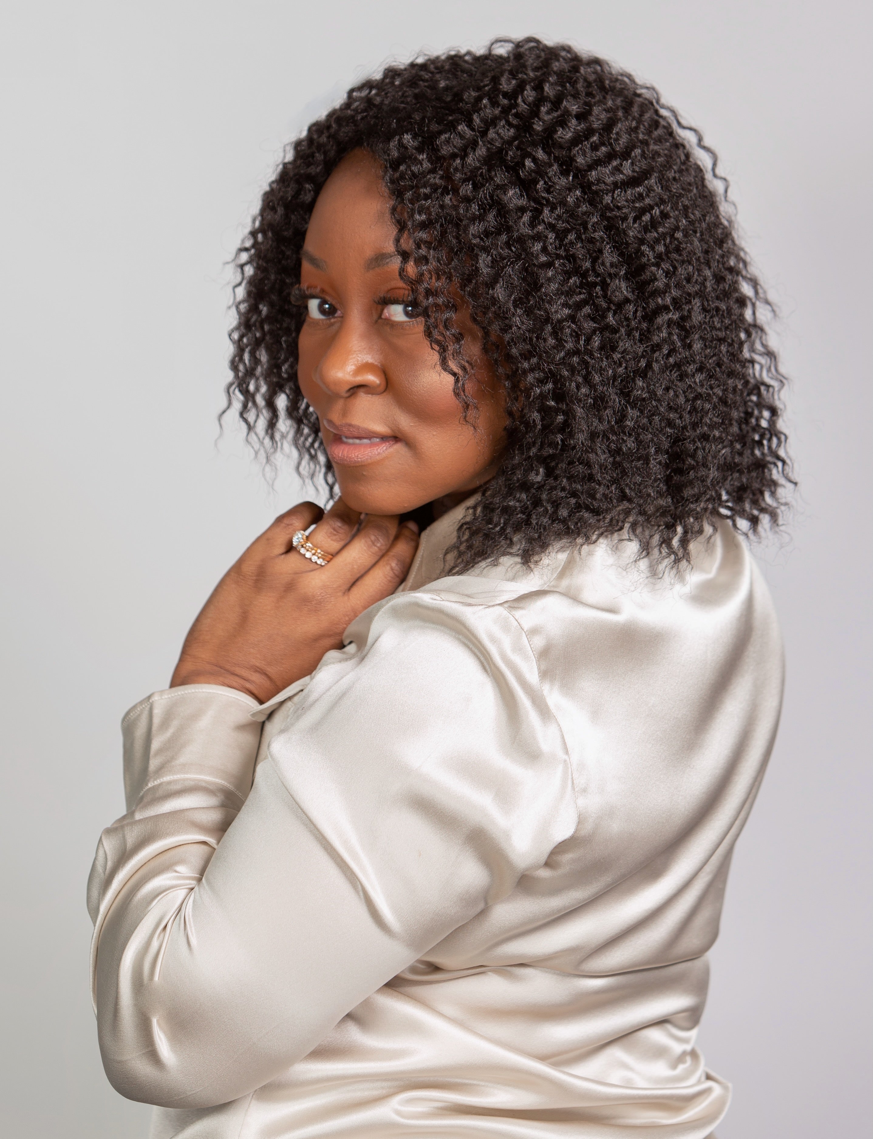 Black woman wearing Coils to Locs Imani wig black
