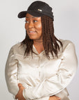 Black woman wearing Coils to Locs Kimmie Cap brown short braids