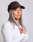 black woman wearing coils to locs kimmie cap short braids grey