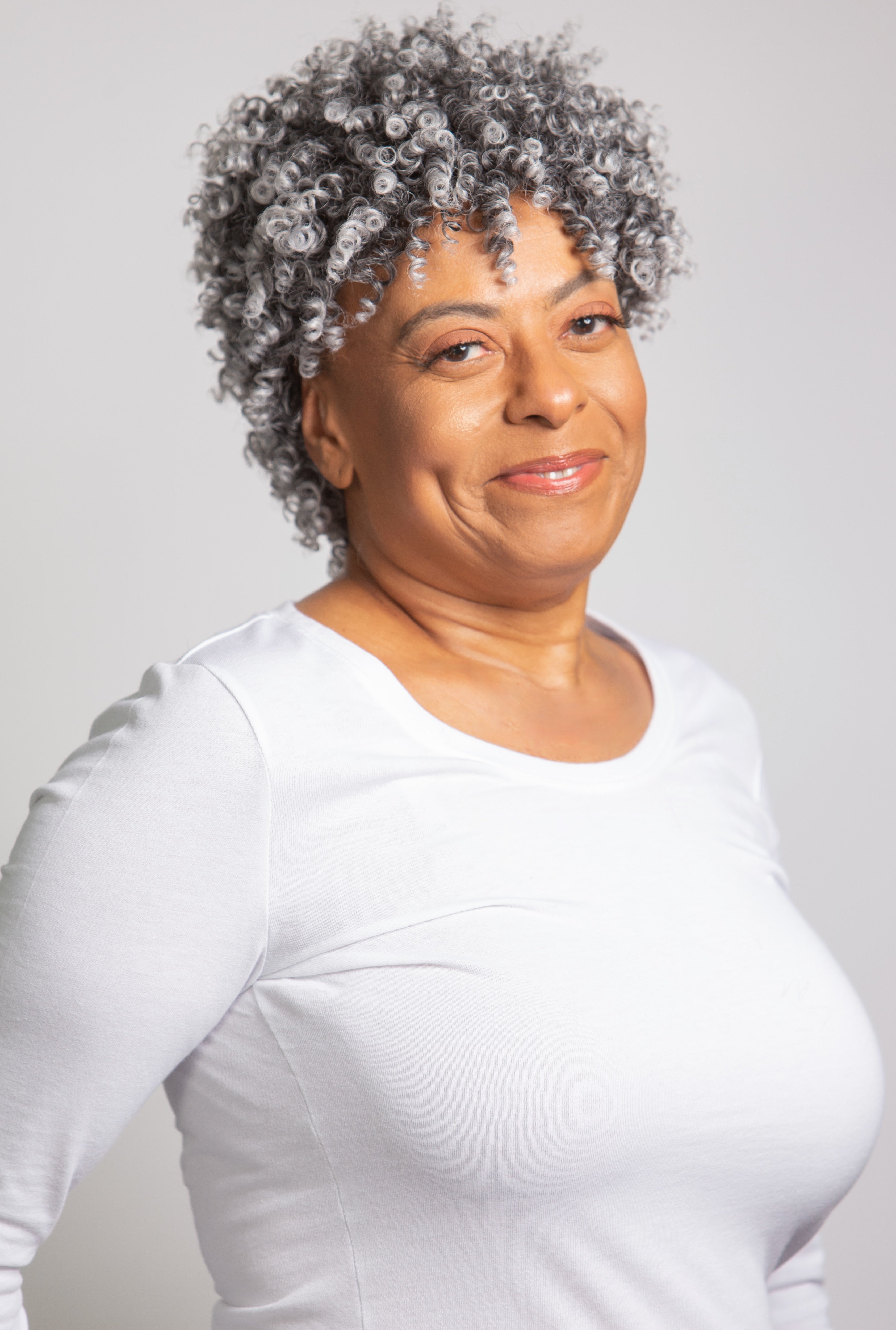 black woman wearing coils to locs jasmine onyx wig