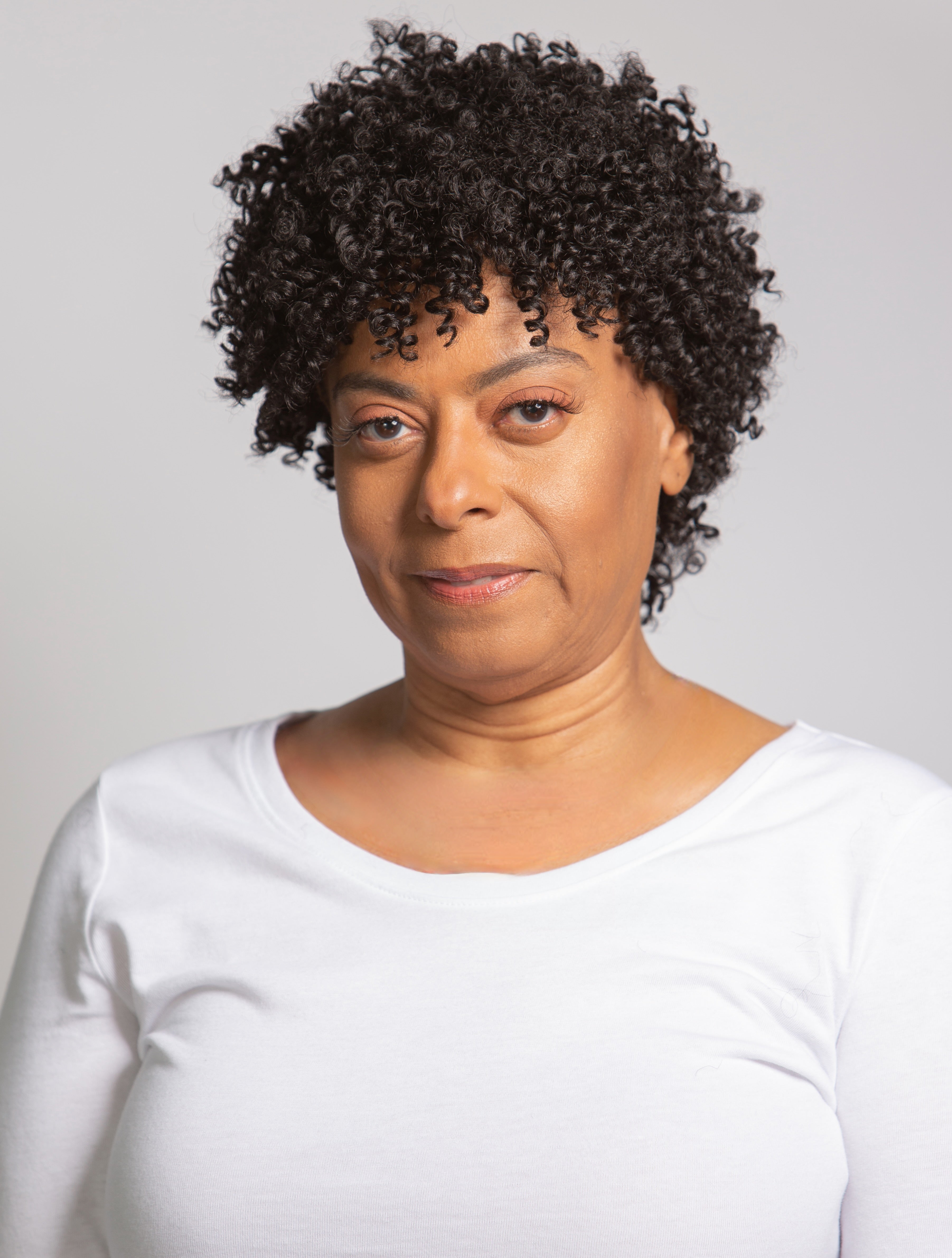 black woman wearing coils to locs jasmine wig black
