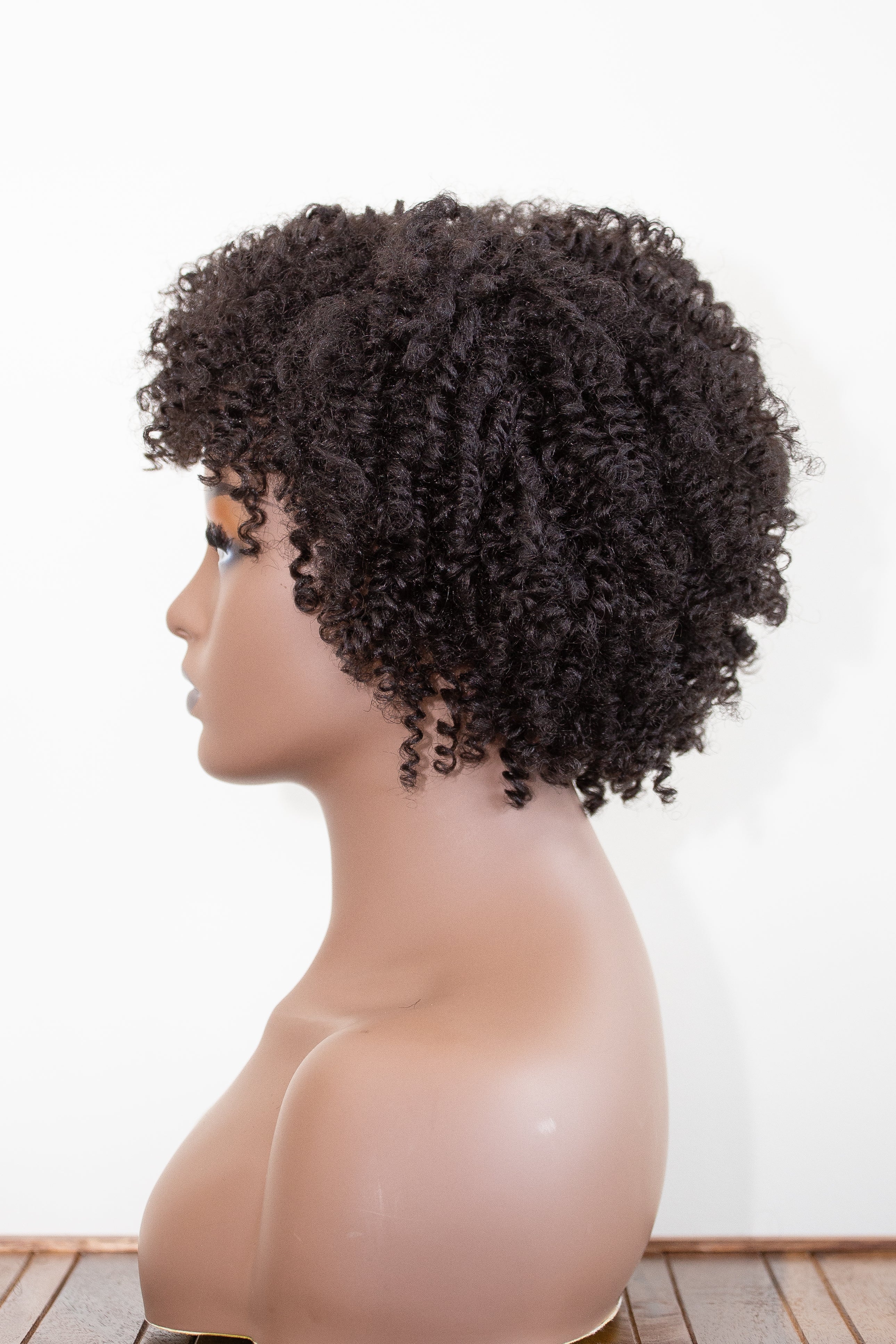 ashanti wig in black on a mannequin head, side view.