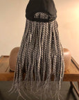 Coils to Locs  18"  braided Kimmie Cap in onyx (gray) showcased on a mannequin head, back view.