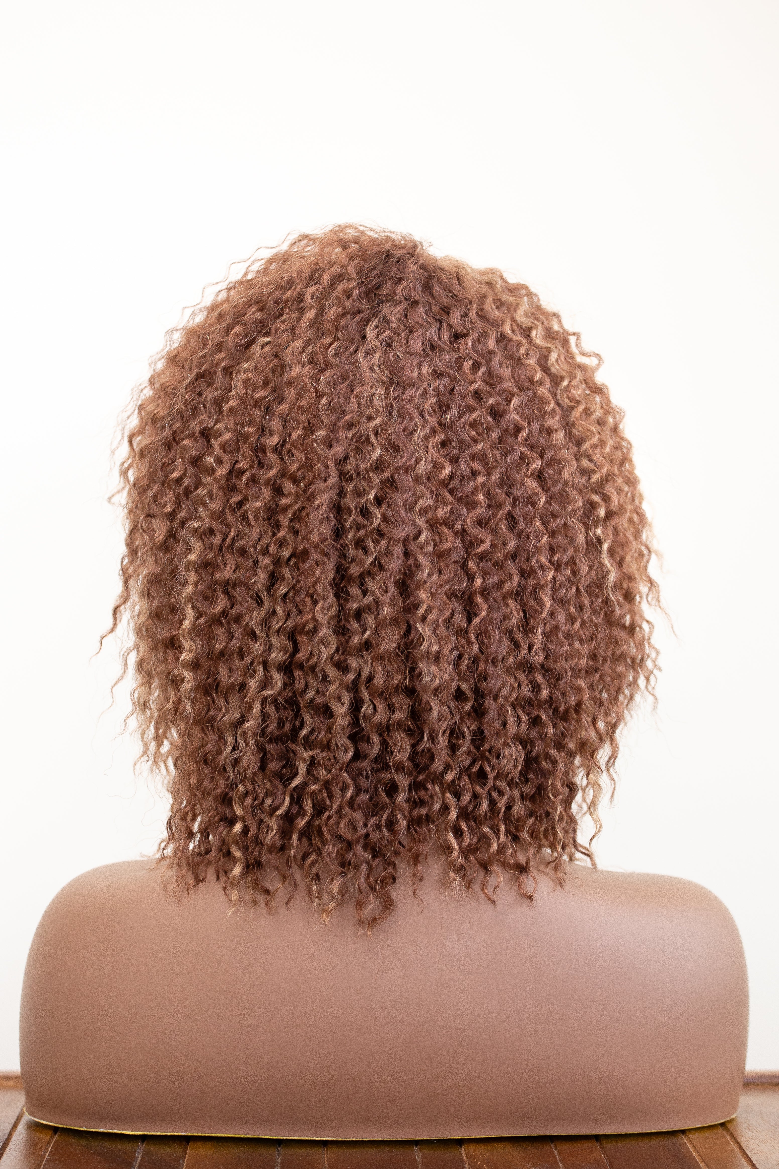 Coils to Locs Imani wig in copper honey brown back