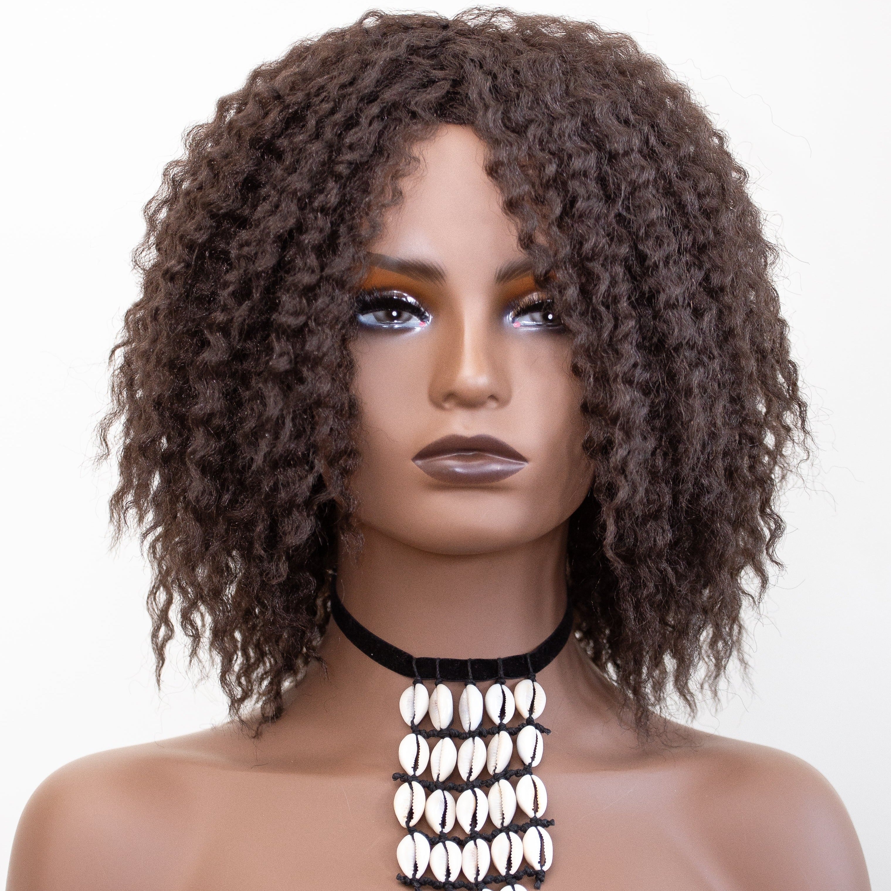 Coils to Locs Imani wig dark brown front with mannequin wearing cowerie shell necklace.