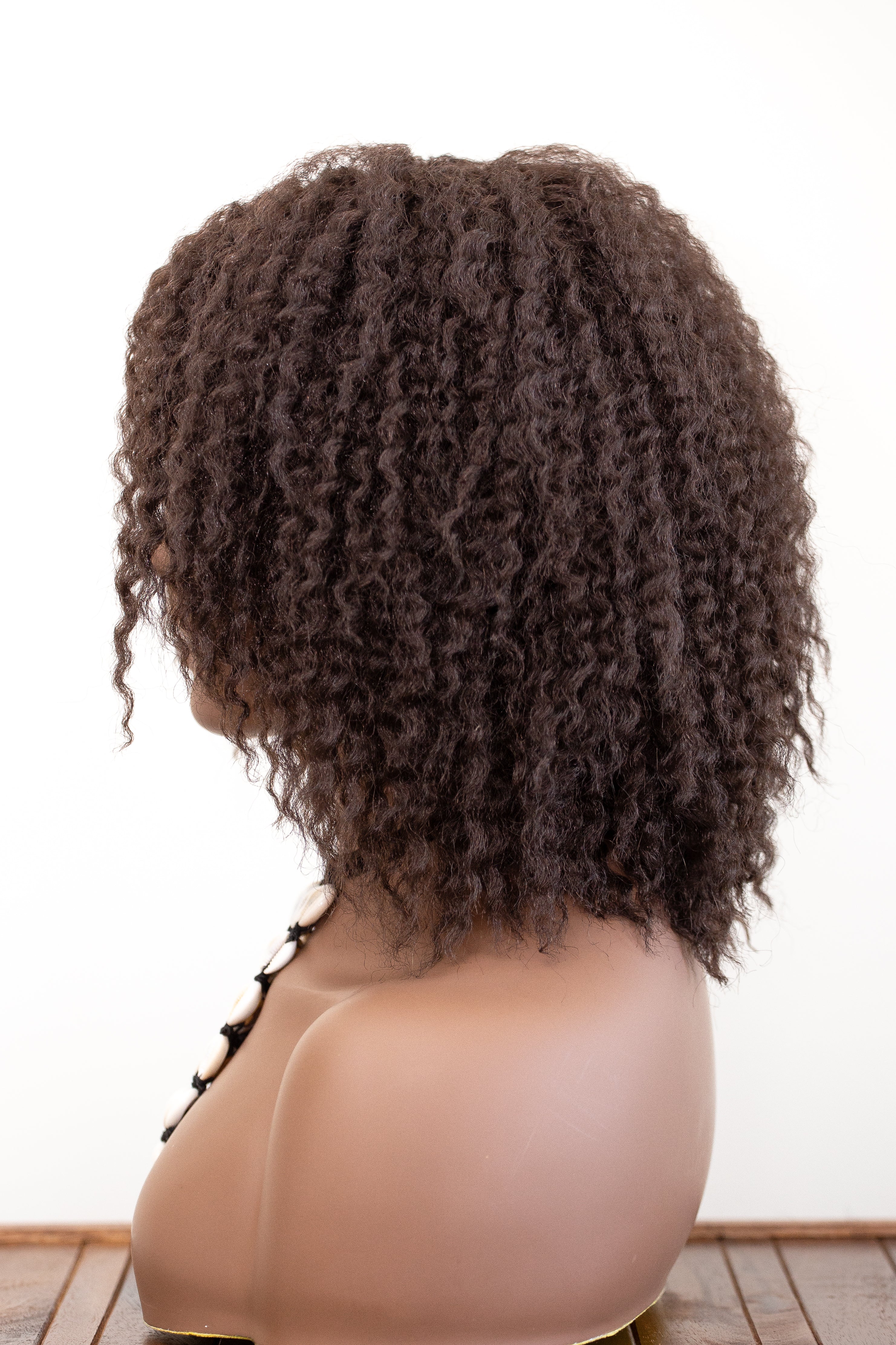 Coils to Locs Imani dark brown wig on mannequin side view