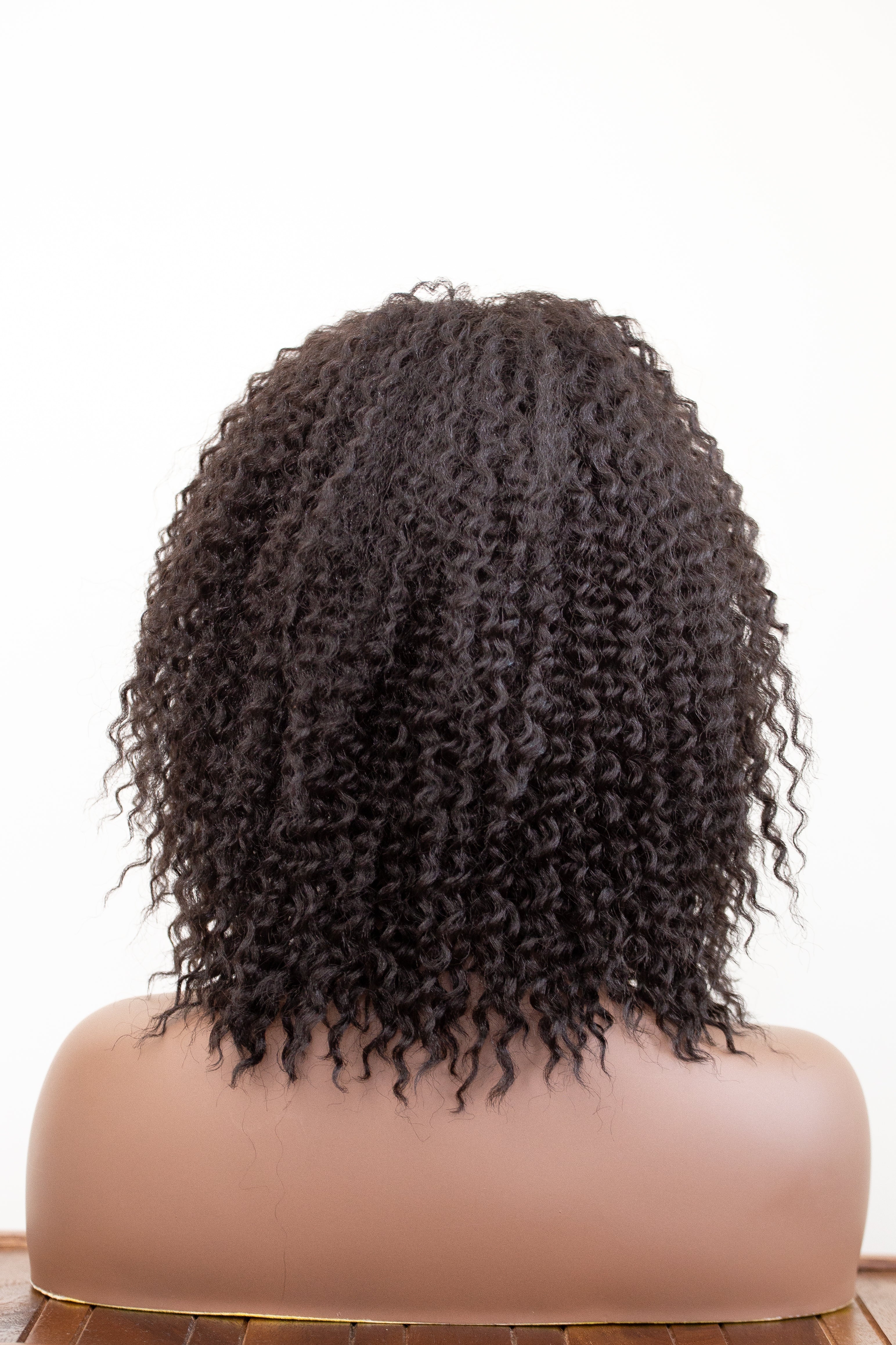 Coils to Locs Imani black wig on mannequin back