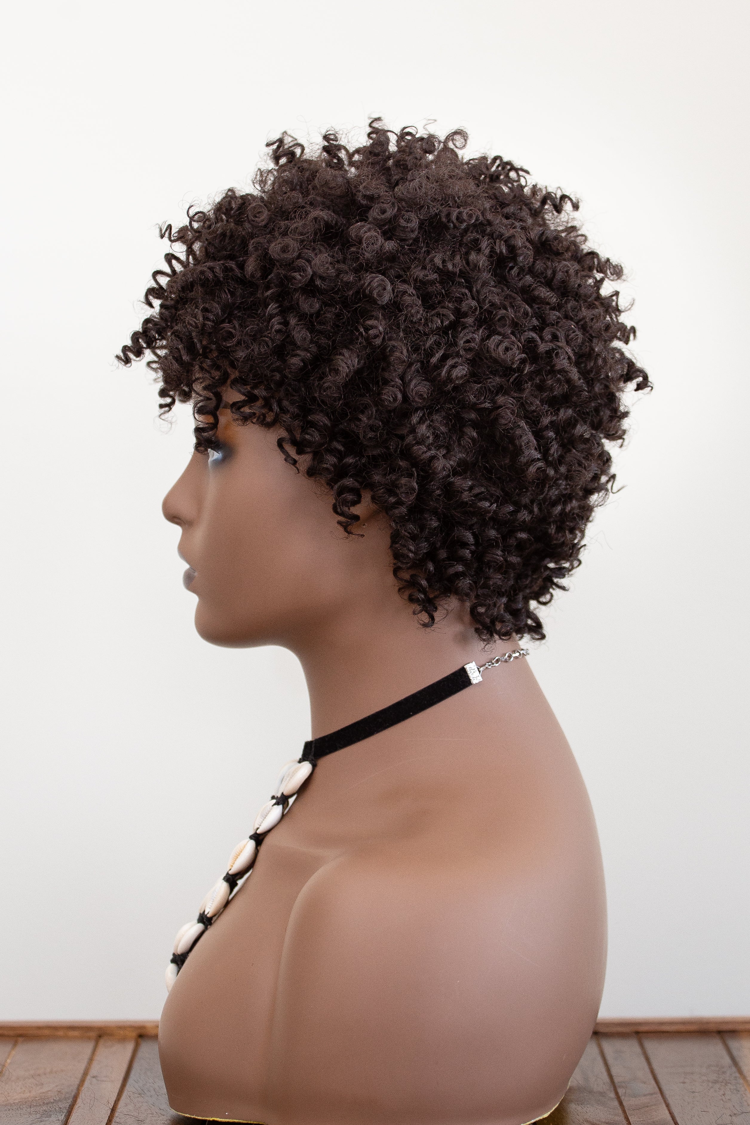 Coils to Locs jasmine dark brown wig on mannequin, side view