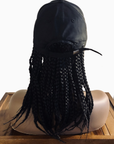 Coils to Locs Kimmie Cap braids in black on a mannequin head, back view.
