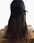 Mannequin head showcasing Coils to Locs Kimmie Cap 12" braids in black copper ombre, back view.