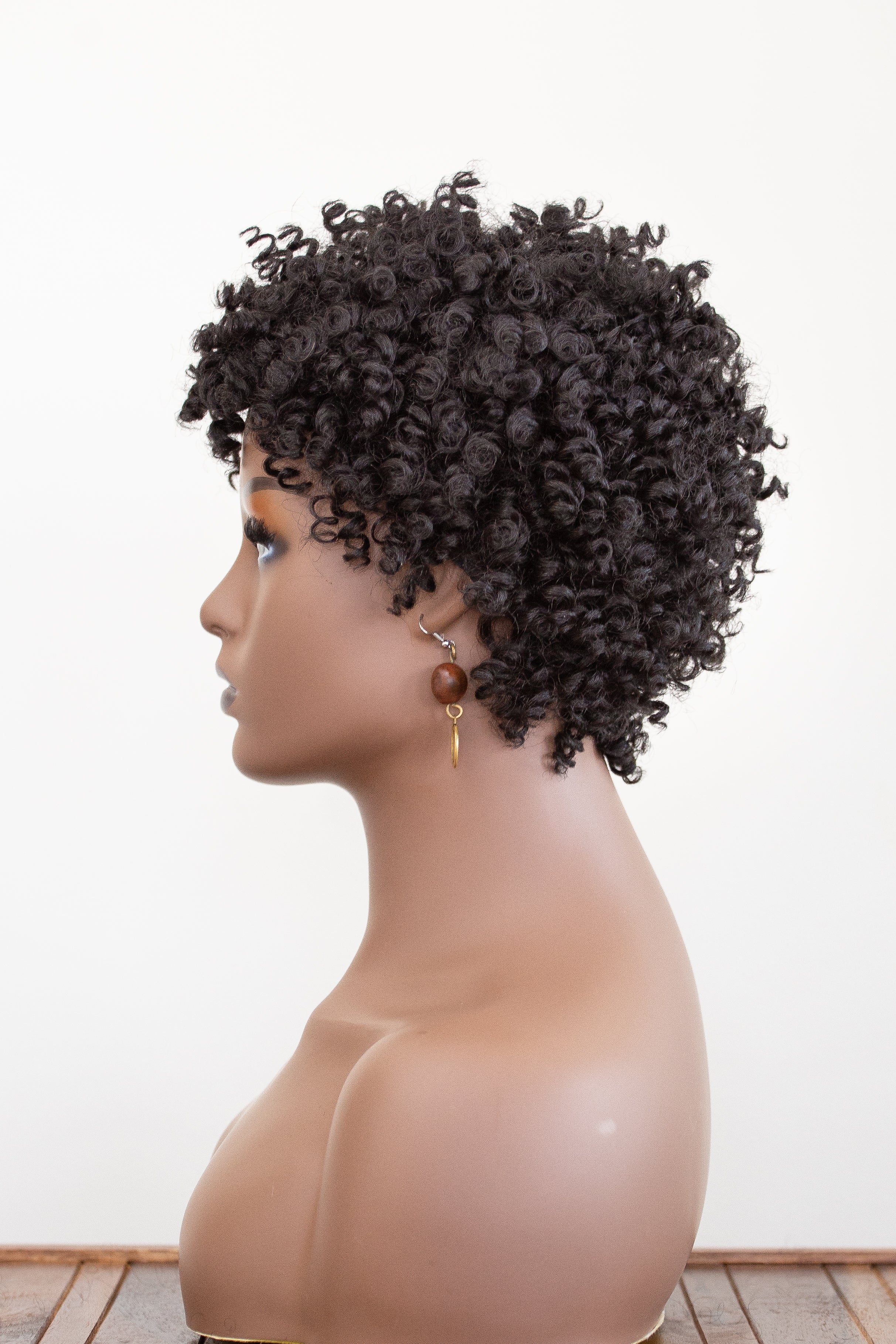 coils to locs jasmine black wig on mannequin with earrings side view